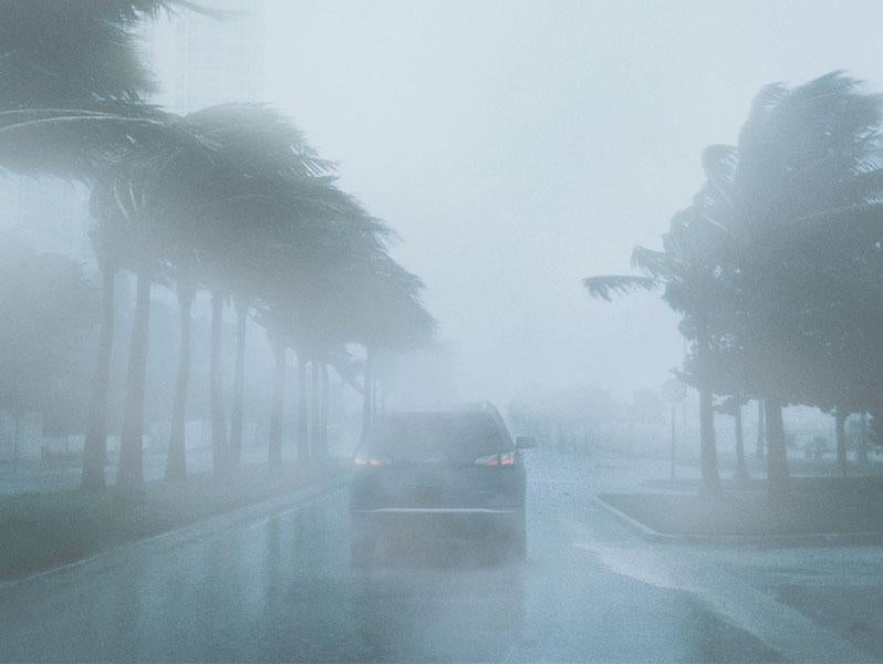 Car driving in a severe storm