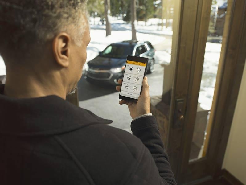 Driver using remote keyfob on smartphone