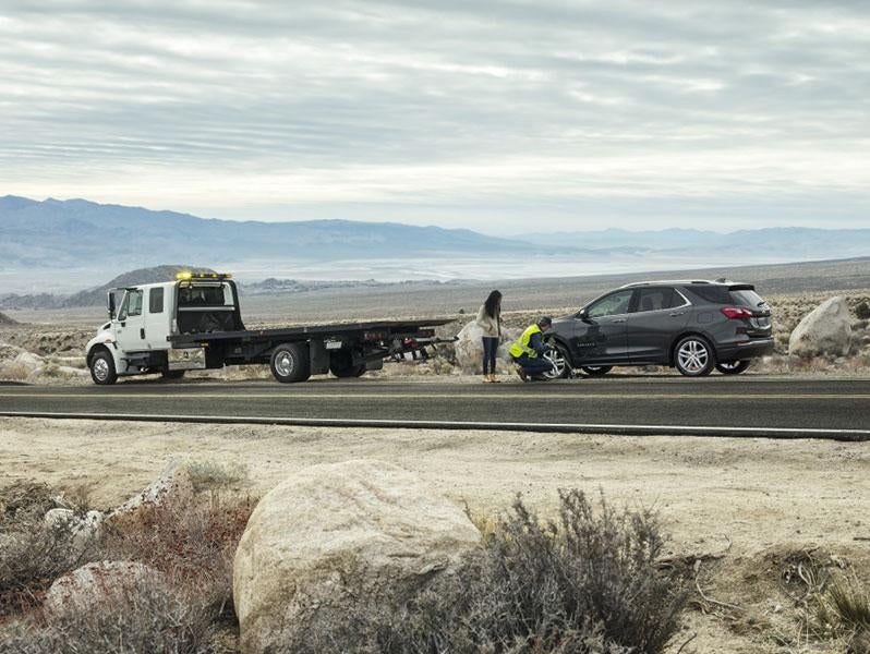 Changing a tire on the side of the road